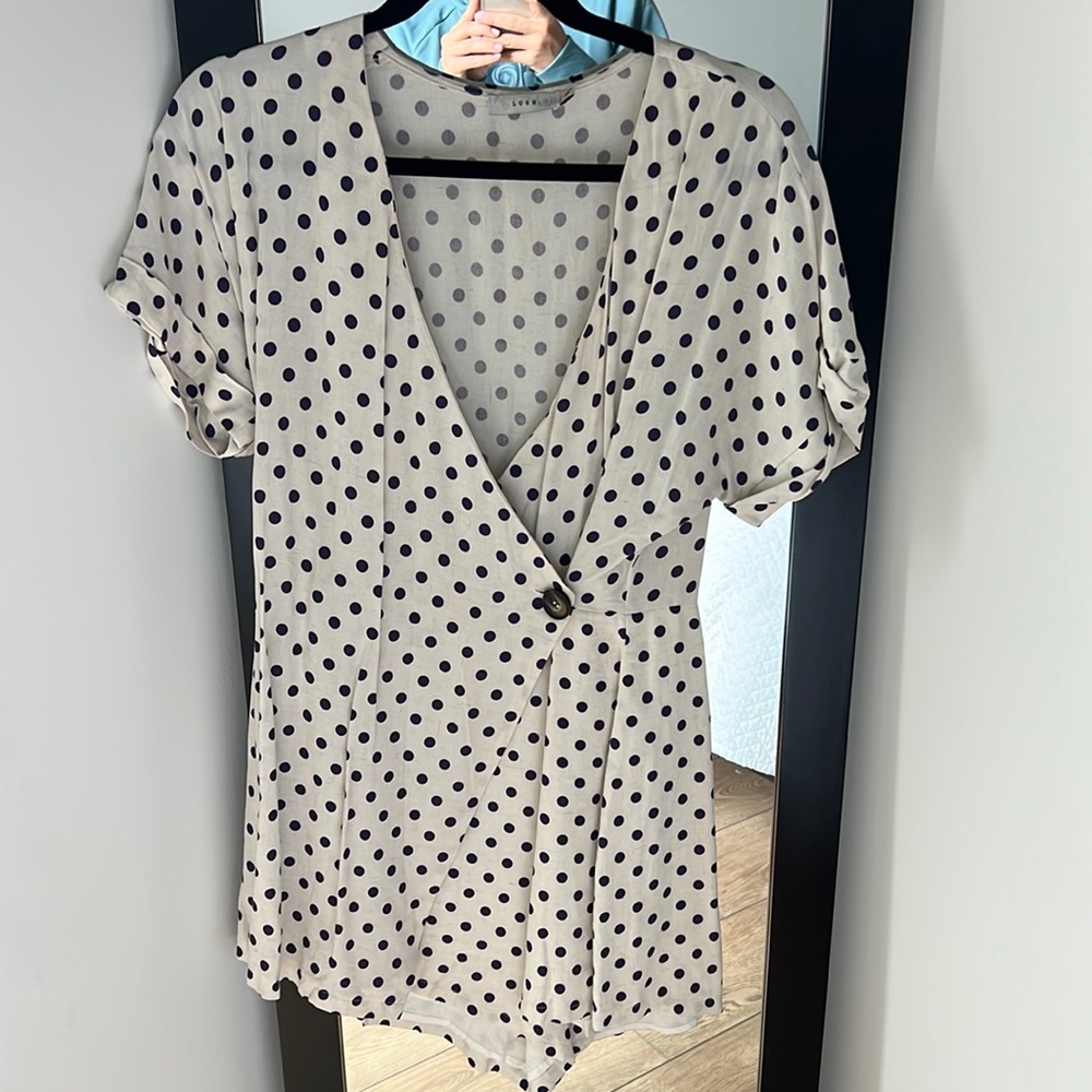 Off white timber with purple polka dots, deep V with button closure. Lush M.